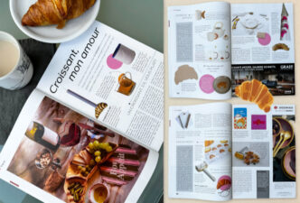 zu sehen ist das aufgeschlagene Magazin mit den 3 Doppelseiten des Artikels sowie ein Croissant auf einem Teller